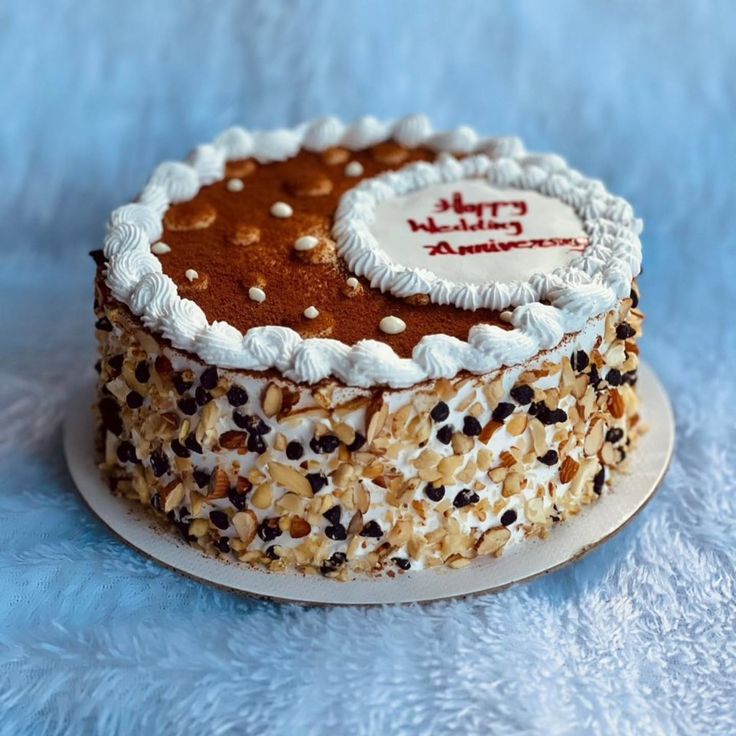 Elegant red velvet anniversary cake with gold accents